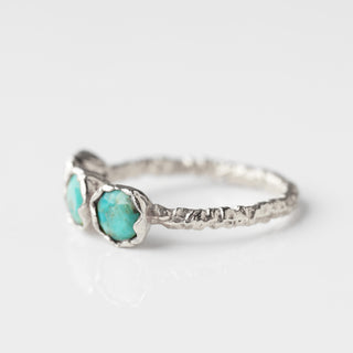 Silver molten ring with green blue stones