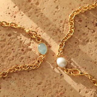 Gold chain with blue aquamarine