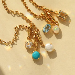 Gold birthstone pendant
