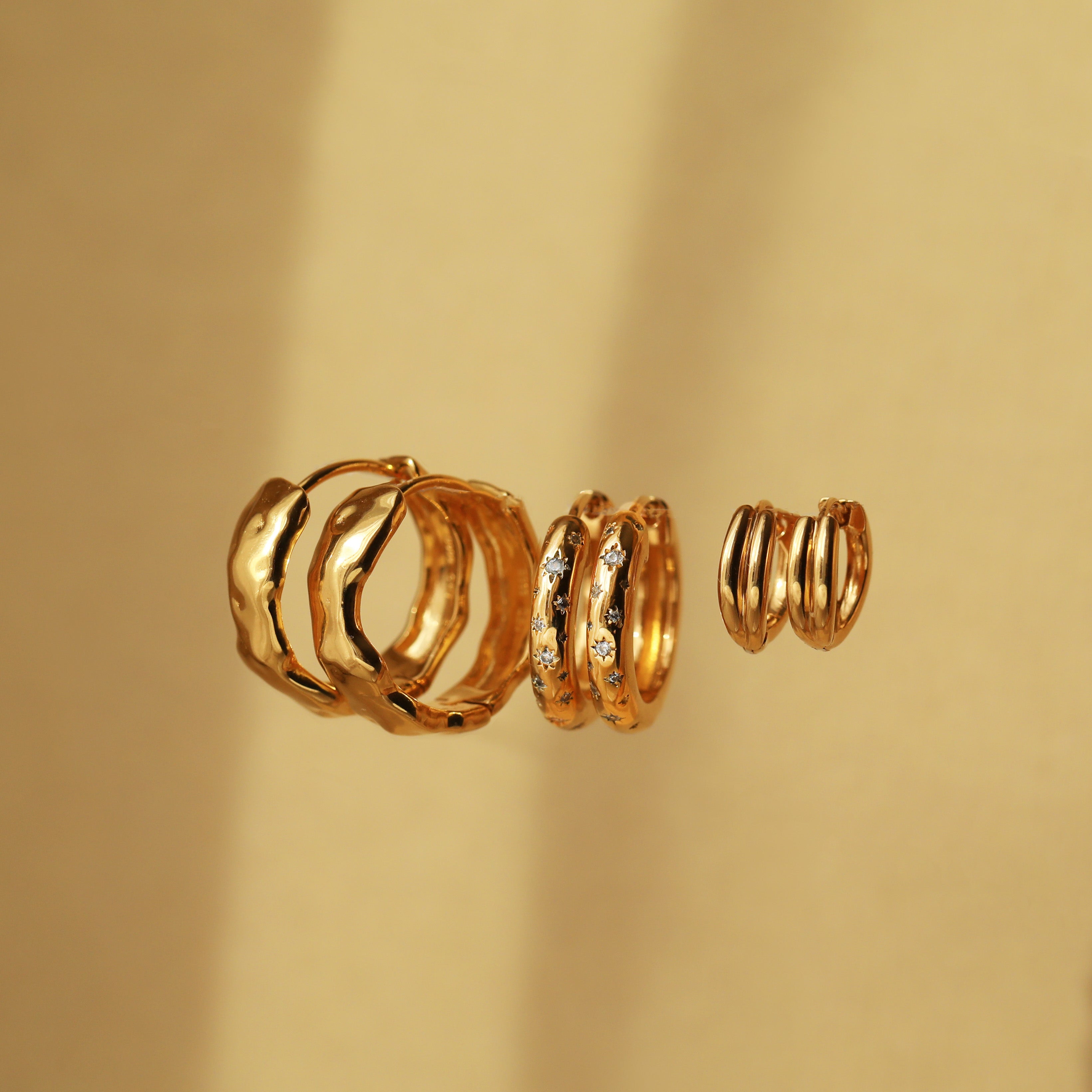gold hoop earrings with stars