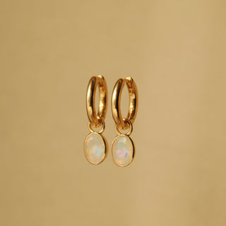 Gold hoop earrings with opal stones 