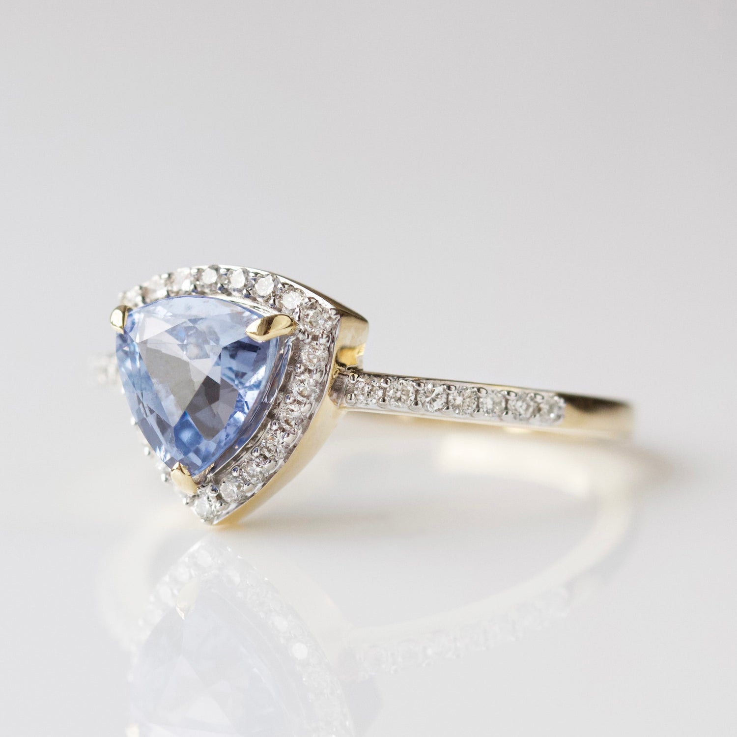 Exclusive blue sapphire and diamond engagement ring in solid gold