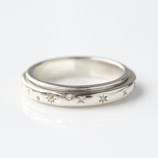diamond and peridot spinning ring in silver